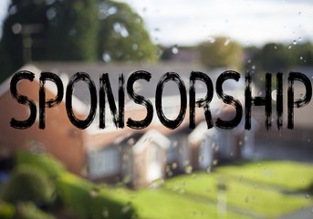 Sponsorship neon sign on brick wall background. Fluorescent Neon tube Sign on brickwork Business...