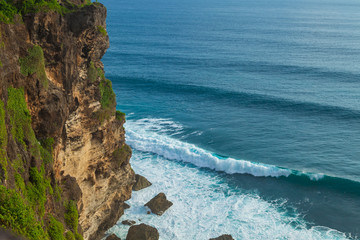 Waves and Uluwatu rock, Bali, Indonesia