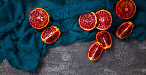 Blood Orange  a knife on a dark Background.Vintage style.Food or Healthy diet concept.Vegetarian.Copy space for Text. selective focus.
