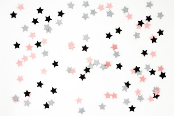 Christmas stars on white background, flat lay, top view
