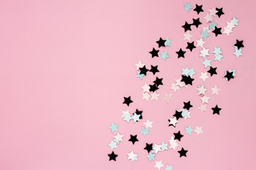 Christmas stars on pink background, flat lay, top view