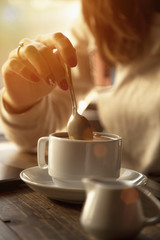 Coffee. Beautiful Girl Drinking Coffee in Cafe. Beauty Model Woman with the Cup of Beverage.