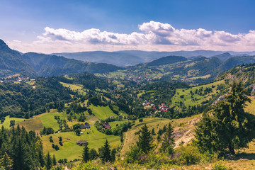 Fototapeta na wymiar Summer alpine Transylvania landmark, landscape with green fields and valleys, high Piatra Craiului mountains, Carpathians, Transylvania, Romania, Europe
