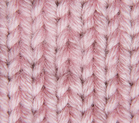 stockings with knitting needles and pink woolen thread