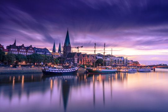 Morning Skyline of  Bremen Old Town as seen over Weser river. Long exposure, artistic filters applied