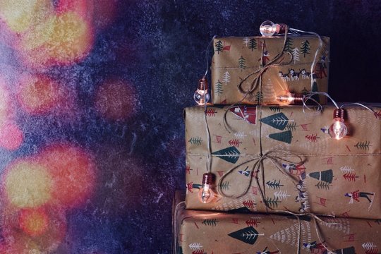 Dark and lights background with gift boxes for Christmas and New Year 