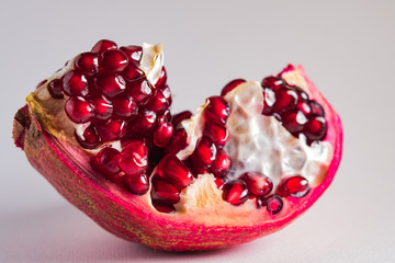 Ripe pomegranate fruit isolated on white background cutout