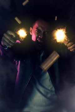 Action movie poster. Young asian man shouting with guns