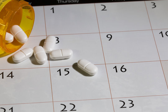 opioid pills spilled out on calendar addiction rehab