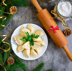 Christmas dumplings with decoration on a grey board. Top view.