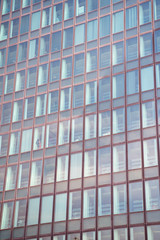 Fototapeta premium Glass windows of office building exterior in paris, france