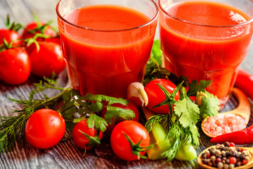 Glass of tomato juice with fresh tomatoes