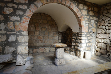 Ancient stone chair for preaching in the church
