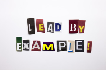 A word writing text showing concept of Lead By Example made of different magazine newspaper letter for Business case on the white background with copy space