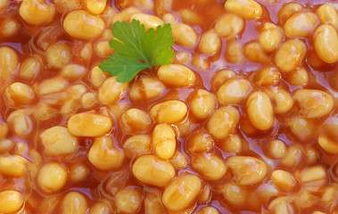 Baked beans in tomato sauce background