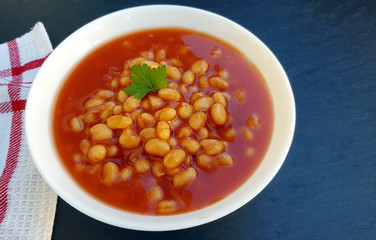 Baked beans in tomato sauce on plate