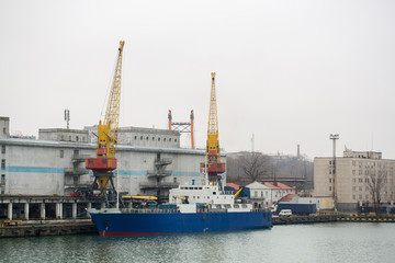 Vessel dry cargo on loading, unloading in port. Bulker in port. port terminal