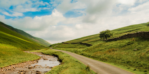 Road and River in Hills, Cumbria, England 