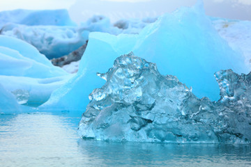 Fototapeta na wymiar Little blue iceberg floating on the sea