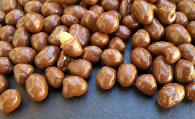 Peanuts in chocolate background