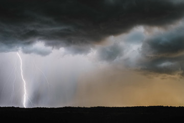 Scenic view of thunderstorm lightning over landscape