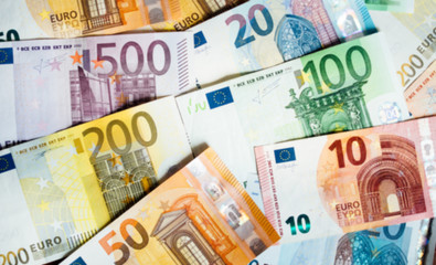 pile of paper euro banknotes as part of the united country's payment system