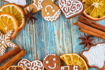 Christmas still life background with gingerbread cookies in decoration frame from festive ingredients on wooden boards