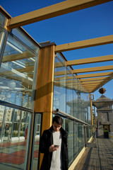 The young man in the modern city look in the phone screen