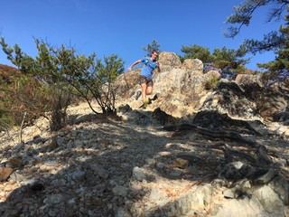 Trail runner on rocky mountain path