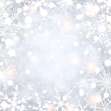 Shining winter background with snowflakes.