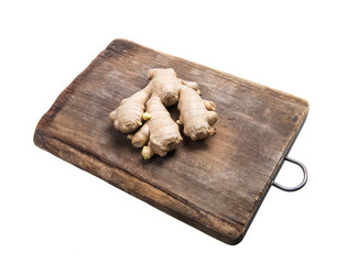 fresh ginger root on cutting board isolated on white