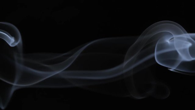 White tobacco smoke line cloud on black background 4k slow-motion video with copy space. Smoking wave floating steaming: cigarette, cigar, vaping, pipe. Nicotine addiction