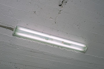 Fluorescent lamp in an industrial room close