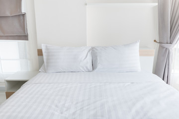 Comfortable soft pillows on the bed in hotel