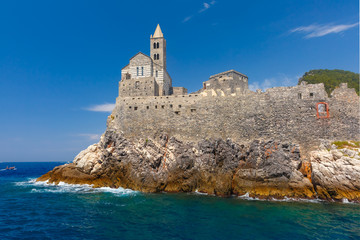 Fototapeta na wymiar View from sea of Porto Venere with Gothic Church of St. Peter, Italian Riviera, Liguria, Italy.