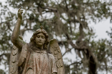 Fototapeta na wymiar Angel Statue with Arm Raised