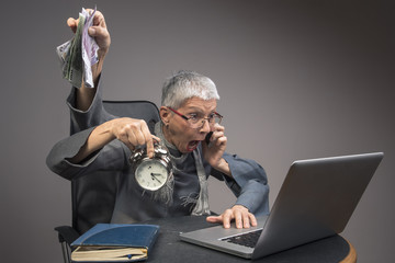 Senior old business woman multitasking in her office