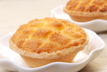 Coconut custard tarts  on white plate