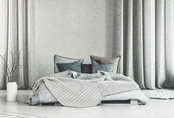 Large bed in room with long white curtains