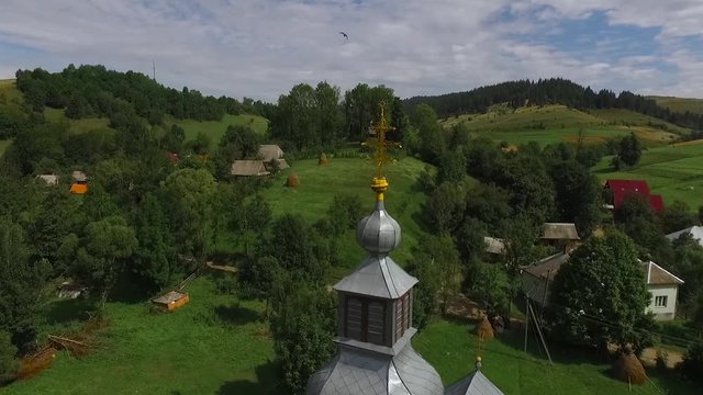 The top of the church dome on the background of a mountain village.