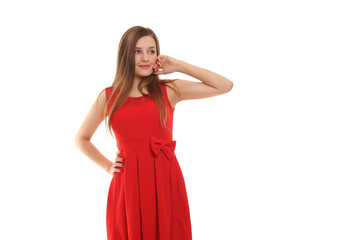 Young girl in a red dress on a white background