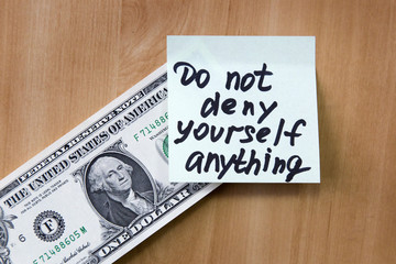 The note is attached to the dollar. On a paper dollar note in anything not deny yourself