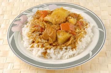Chicken curry over steamed white rice.