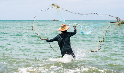 fishing man hunting fish by fishing net, fishing, hunting fish. © Madam Kaye