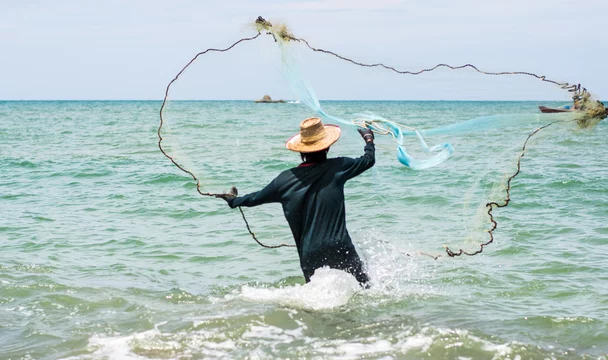 fishing man hunting fish by fishing net, fishing, hunting fish. Stock Photo  | Adobe Stock