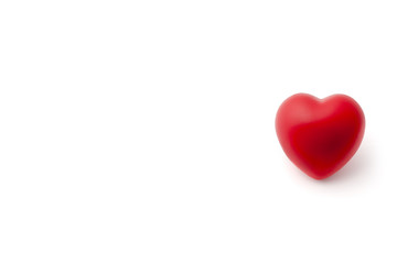 Red Rubber Heart on White Background with Copy Space