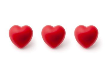 Three Red Hearts in a Row on White Background