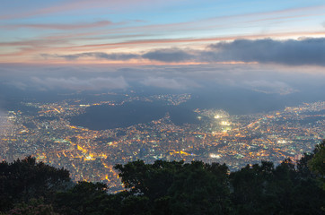 Panoramic view  of Caracas city, at sunset, from a lookout in Avila mountain, in Venezuela.