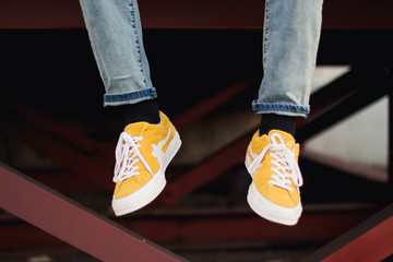 Yellow shoes dangling