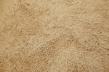 Brown woolen carpet texture background